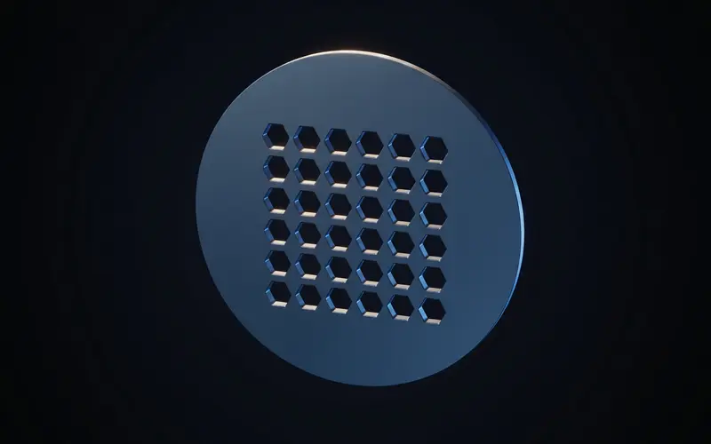 A round ventilation grille with a hexagonal perforation pattern inside a solid frame ring