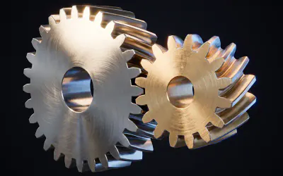 A helical gear pair in steel and brass seen from a steep angle, teeth fully engaged