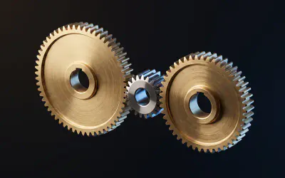 A three stage gear train: a brass wheel, a steel idler pinion and a second brass gear