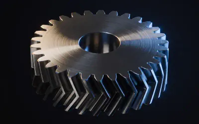 A herringbone gear machined from dark steel, seen from above so the chevron teeth read